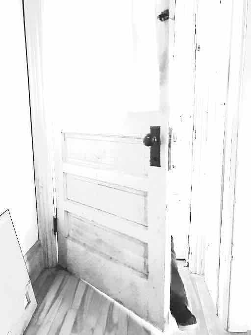 door opening, person striding in, reverse smaller faded image of home page image, 